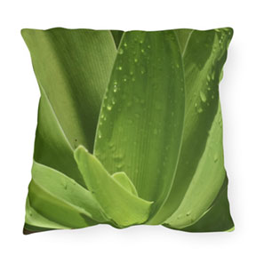 Green Leaves Square Outdoor Pillow on a Bench